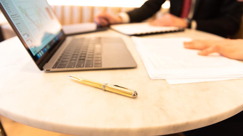 laptop and papers on desk